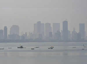 Mumbai: Boats are seen vaguely amid hazy weather, in Mumbai, at Bandra in Mumbai...