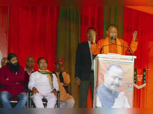 Palampur: Uttar Pradesh CM Yogi Adityanath addresses during an election campaign...