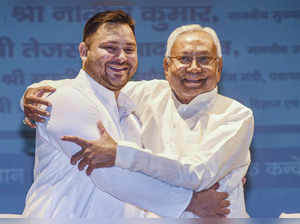 Patna: Bihar Chief Minister Nitish Kumar being greeted by Deputy CM Tejashwi Yad...