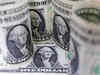 Dollar slumps after CPI data suggests Fed may ease rate hikes
