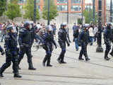 Riot police patrol