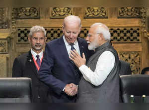 Indian Prime Minister Narendra Modi shakes hands with U.S. President Joe Biden a...