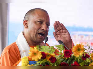 Varanasi: Uttar Pradesh Chief Minister Yogi Adityanath addresses during an event...