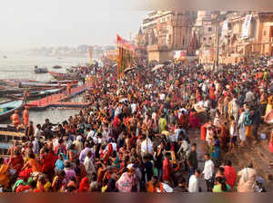 Varanasi: Devotees gather on the banks of river Ganga to take a 'holy dip' on th...
