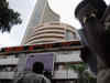 Sensex, Nifty trade flat in early trade; railway stocks rally