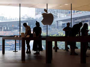 People look at Apple products as Apple Inc's new iPhone 14 models go on sale in Beijing