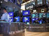 Wall St falls on mixed economic data, Fed official's hawkish view