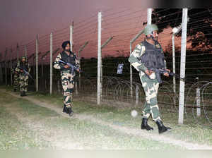 Jammu, Oct 21 (ANI): Border Security Force (BSF) personnel patrol along India-Pa...