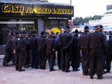 Police officers form a cordon aroud locals