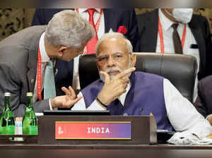 Nusa Dua: India's Prime Minister Narendra Modi, right, speaks with Foreign Minis...