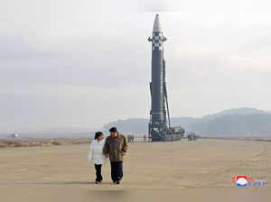 Seoul :North Korean leader Kim Jong-un (R), alongside his daughter wearing a winter jacket, views a new type of the Hwasong-17 intercontinental ballistic missile (ICBM) during an on-site inspection of the missile launch at Pyongyang International Airport on Nov. 18, 2022.(Yonhap/IANS)