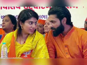 Jamnagar, Nov 14 (ANI): Indian cricketer Ravindra Jadeja interacts with his wife...