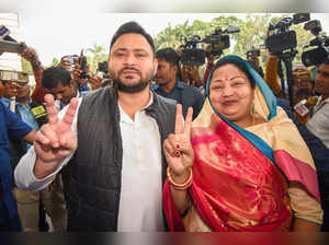 Patna: Newly elected RJD MLA Neelam Devi with party leader and Dy CM Tejashwi Ya...