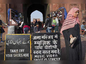 New Delhi: A woman outside the premises of the Jama Masjid, in New Delhi. The ad...