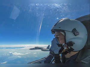 In this photo released by Xinhua News Agency, an air force pilot from the Easter...