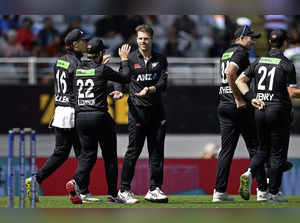 New Zealand bowler Lockie Ferguson, center, celebrates with teammates after the ...