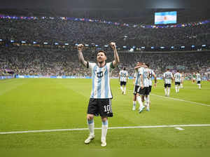 Argentina's Lionel Messi celebrates after scoring his side's opening goal during...