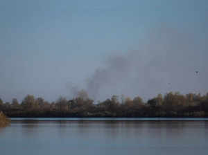 Smoke rises after shelling at an opposite side of the Dnipro river as Russia's retreat from Kherson, in Kherson