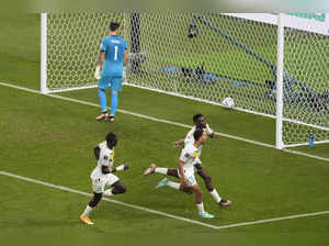 Doha: Senegal's Famara Diedhiou, back right, celebrates after scoring off a pena...