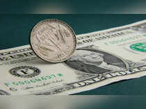 Rupee gains 17 paise to 81.55 against US dollar