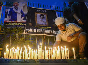 Jalandhar: Youngsters during a candlelight march to pay tribute to Punjabi singe...