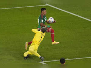 Poland's goalkeeper Wojciech Szczesny saves on an attempt to score by Mexico's J...