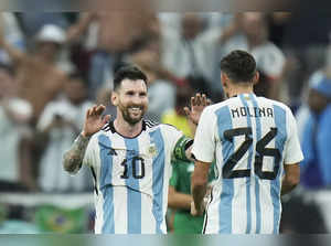 Argentina's Lionel Messi celebrates with Nahuel Molina after their team won the ...