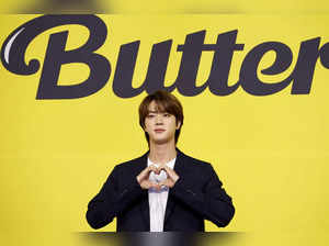 K-pop boy band BTS member Jin poses for photographs during a photo opportunity promoting their new single 'Butter' in Seoul