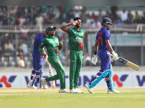 Bangladesh's Ebadot Hossain, center, celebrates the wicket of India's Shreyas Iy...