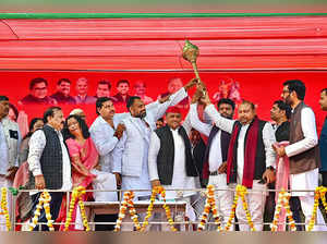 Mainpuri: Samajwadi Party President Akhilesh Yadav being presented a mace during...