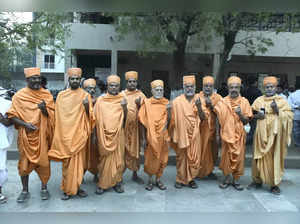 Vadodara : Saints of Swaminarayan Gurukul after casting their votes during the s...