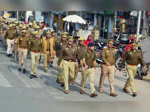 Mathura: Police personnel conduct a flag march near Sri Krishna Janmabhoomi and Shahi Idgah Mosque on the eve of Babri Mosque Demolition Day, in Mathura on Monday, Dec. 05, 2022. (Photo: Yuvnish/IANS)