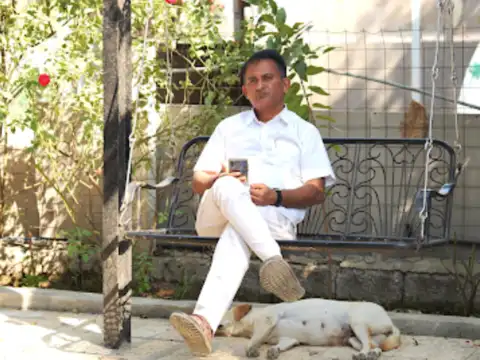 MLA carries 'gas cylinder' to cast vote