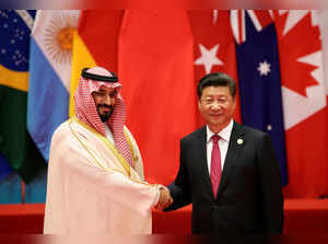 FILE PHOTO: Chinese President Xi Jinping shakes hands with Saudi Arabia's Deputy Crown Prince Mohammed bin Salman during the G20 Summit in Hangzhou