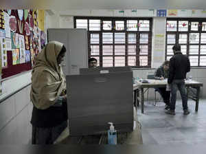 New Delhi: A voter casts her vote for the Municipal Corporation of Delhi (MCD) e...