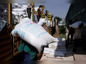 FILE PHOTO: Labourers offload bags of grains as part of relief food that was sent from Ukraine at the WFP warehouse in Adama town.