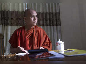 FILE PHOTO: Myanmar's firebrand Buddhist monk Wirathu sits in a supporter's home during a Reuters interview in Yangon