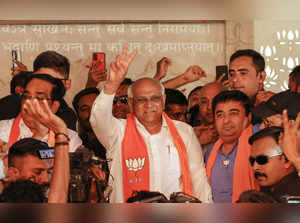 Gandhinagar: Gujarat Chief Minister and BJP candidate Bhupendra Patel flashes th...