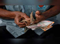 Rupee ends flat as broader markets muted on growth concerns