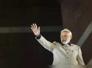 New Delhi: Prime Minister Narendra Modi waves at supporters during the celebrati...