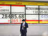 Asian shares higher as dollar retreats, risk events abound