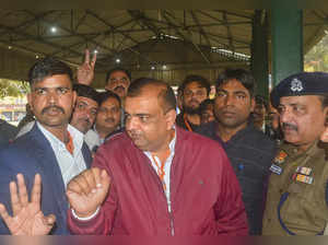 Rampur: BJP candidate Akash Saxena (in red) celebrates after winning the Rampur ...