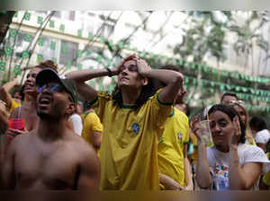 Brazilian fans watch the FIFA World Cup match, in Rio de Janeiro