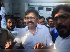 Thane: NCP leader Jitendra Awhad comes out of a court after being granted bail, ...