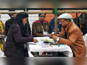 Polling officials count votes for the MCD polls