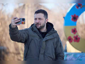 FILE PHOTO: Ukraine’s President Zelenskiy captures a video to congratulate the Ukrainian Armed Forces amid Russia’s attack on Ukraine, near the town of Sloviansk