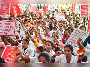 Bengaluru: Covid warriors, medical students and healthworkers during a protest d...
