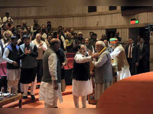 Prime Minister Narendra Modi being felicitated by BJP National Presid...