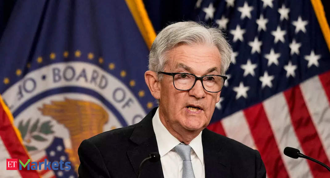 Fed downshifts to half-point hike, sees 5.1% rate next year