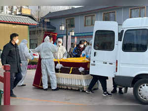 Workers at a funeral home in Beijing